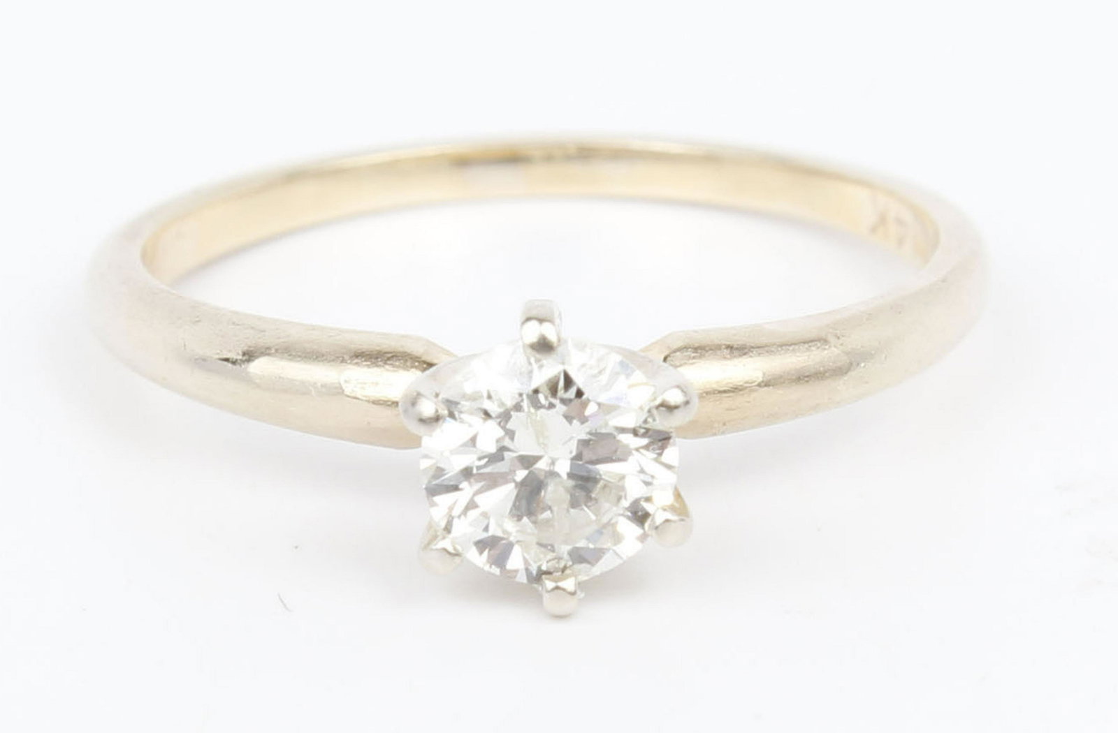14K YELLOW GOLD .20CT DIAMOND SOLITAIRE RING: Ladies 14k yellow gold diamond solitaire ring. A center round light yellow .20CT diamont, in a six prong setting. Band is 2mm. Size 5 Weight: 1.6 grams Size: 5 Condition: Very Fine.