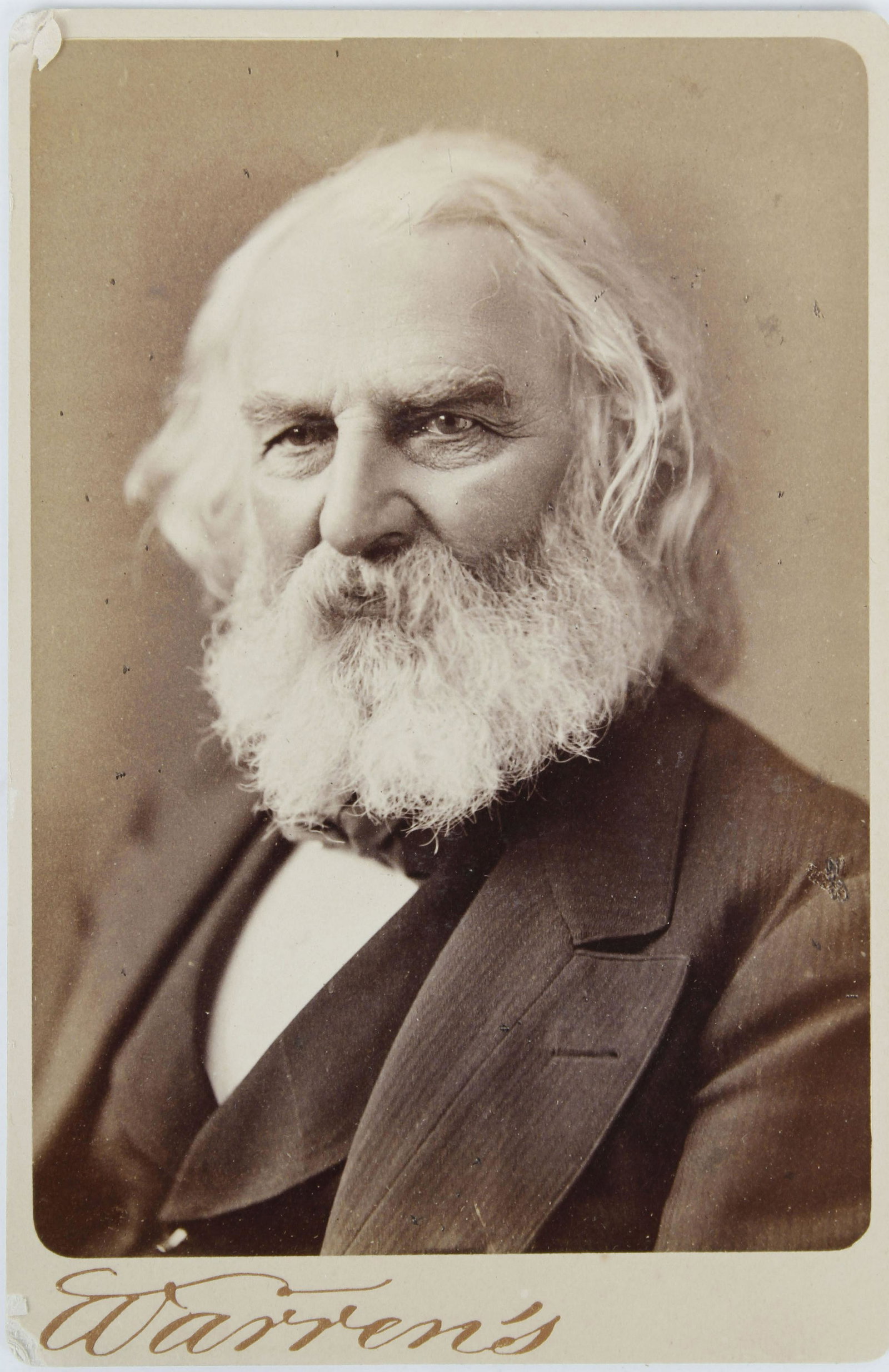 HENRY WADSWORTH LONGFELLOW "WARREN'S" CABINET CARD: Henry Wadsworth Longfellow (1807 - 1882) was an American poet and educator whose works include "Paul Revere's Ride", The Song of Hiawatha, and Evangeline. He was also the first American to translate D