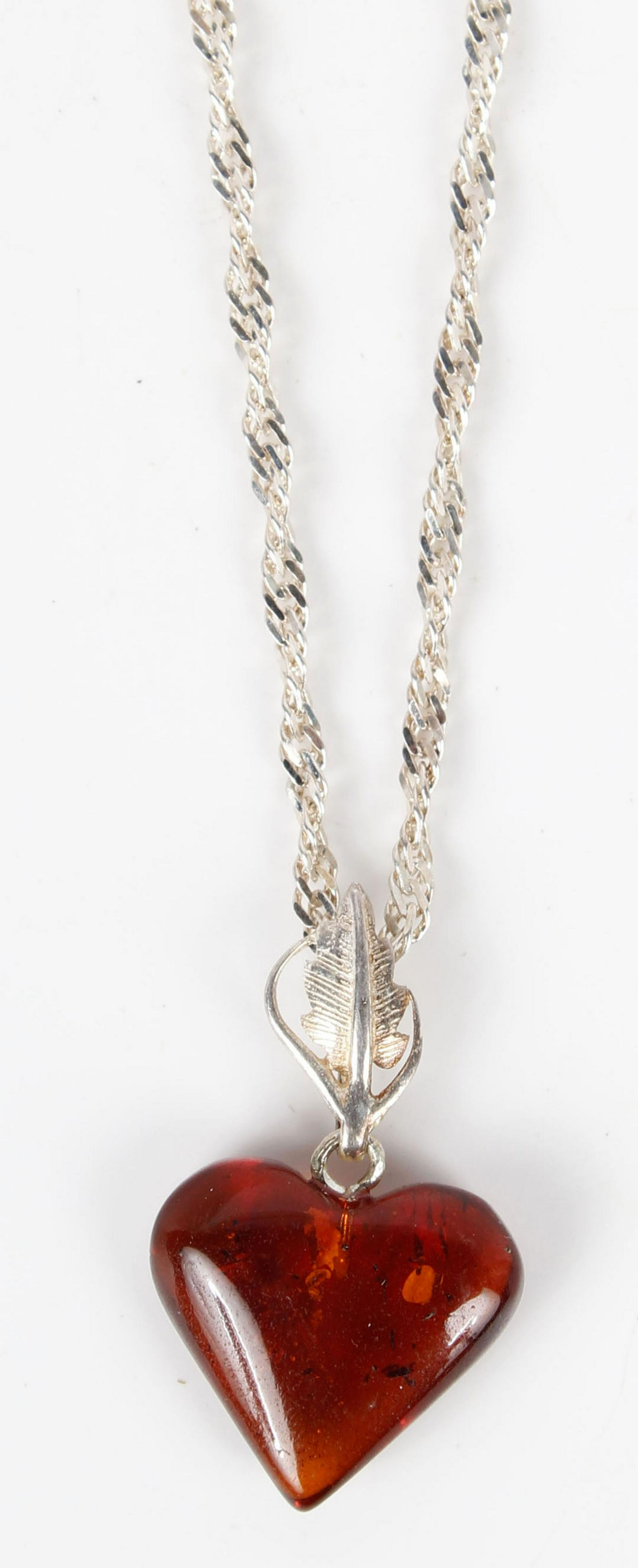 925 SILVER CHAIN WITH AMBER HEART PENDANT: .925 silver necklace with amber heart pendant. Condition: Very Fine