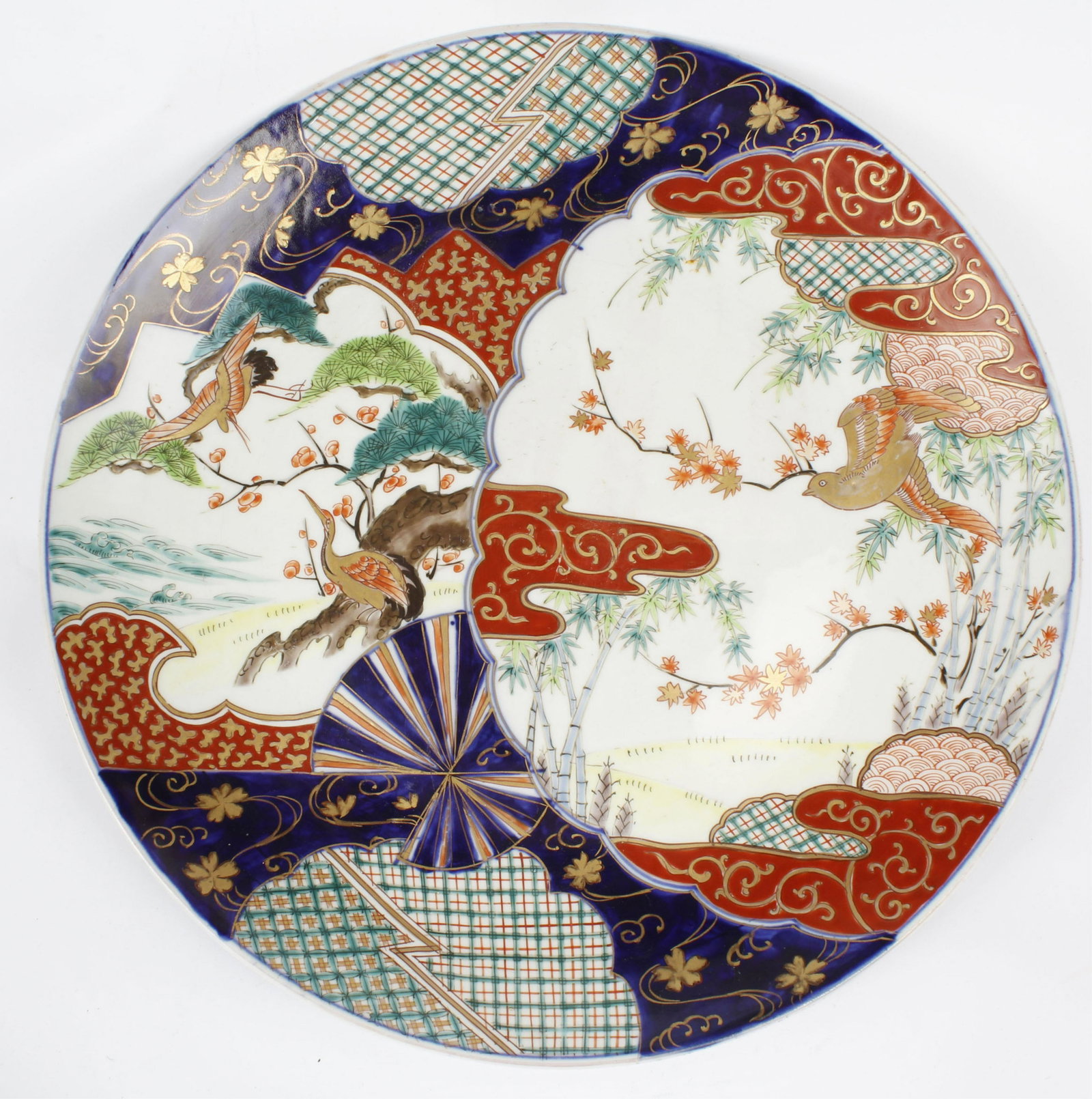 EXTRA LARGE CHARGER PLATE CRANE SWALLOW DOVE GILT: Extra large size charger plate. Hand painted porcelain. 1 side depicts several cranes while the other side shows a swallow or dove. Gilt painted throughout. Signed underneath. 15.5" Diameter Size:15.5