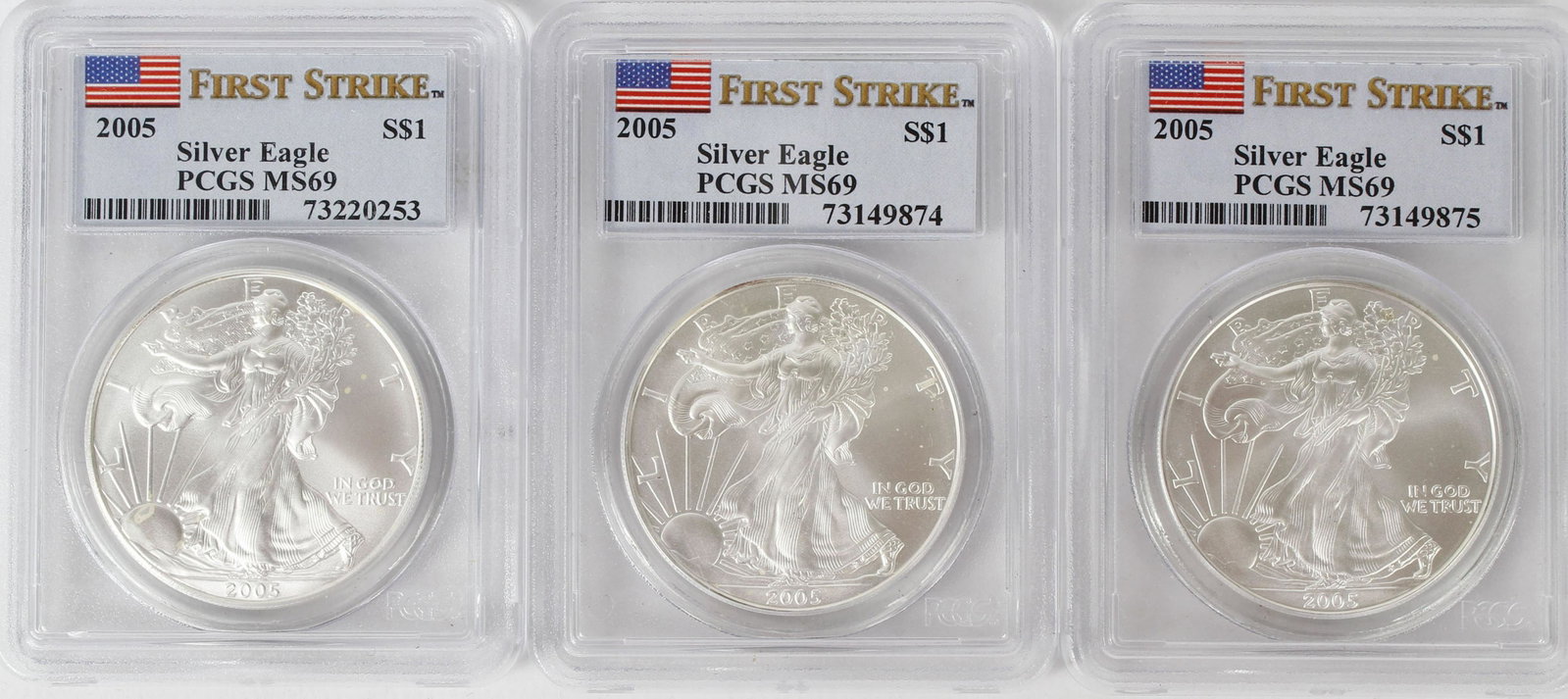 2005 FIRST STRIKE SILVER EAGLES: 3 2005 first strike silver eagles Mint State 69 PCGS US Flag label