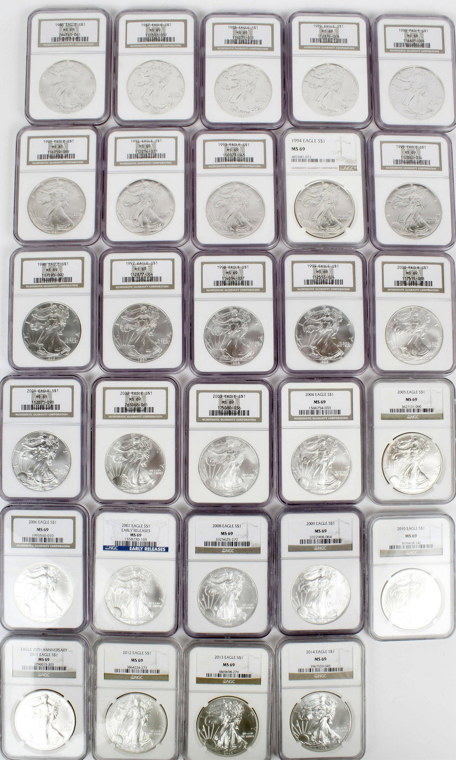 NGC MS69 COMPLETE DATE RUN SILVER EAGLES 1986-2014: A complete date run of Silver eagles in NGC ms 69 including the rare 1996 and key 1993 as well as the scarce 86 to 99 run. 28 COINSDESIGNER: Adolph A. Weinman/John Mercanti EDGE: Reeded DIAMETER: 40.6