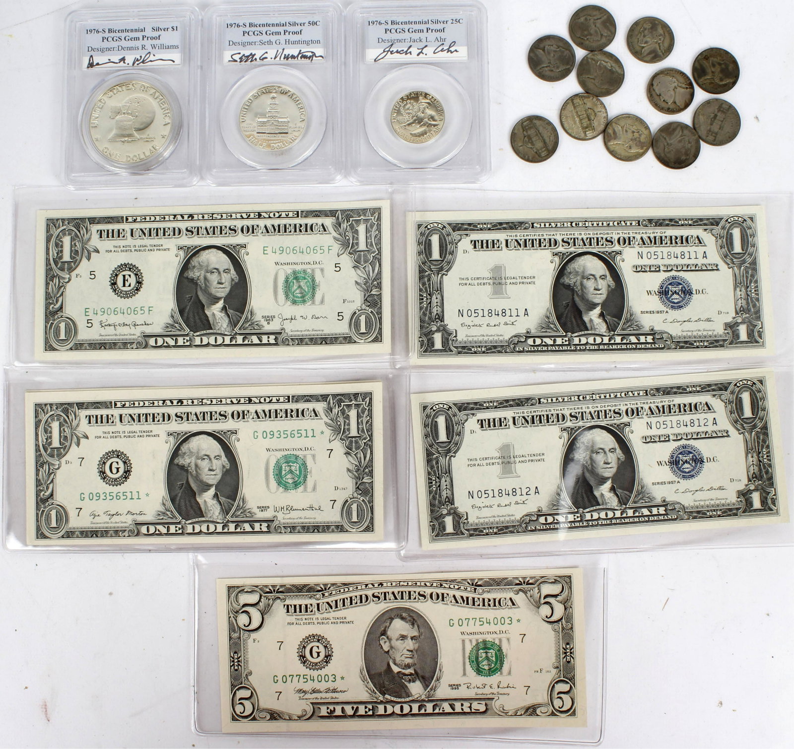 SILVER AND SILVER CERTIFICATES COINS AND CURRENCY: Collector lot of Two series of 57a uncirculated $1silver certificates, Two federal reserve $1, and a $5 star note, along with One PCGS certified 1976-s Gem proof silver Bicentennial set. One Dollar, h