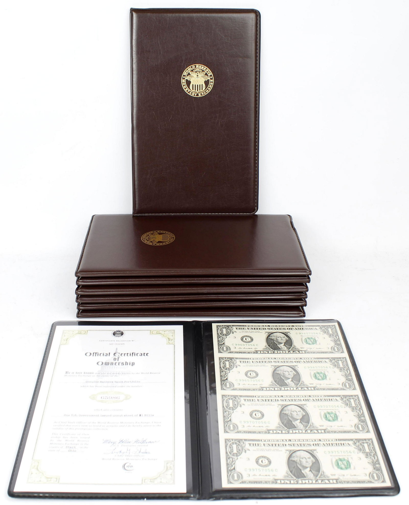 LOT OF 8 BANKERS PORTFOLIO UNCUT SHEET $1 BILLS: Lot of 8 genuine bankers vault portfolios, each containing 4 uncut $1 bills and official certificates of ownership. Condition: Very Fine