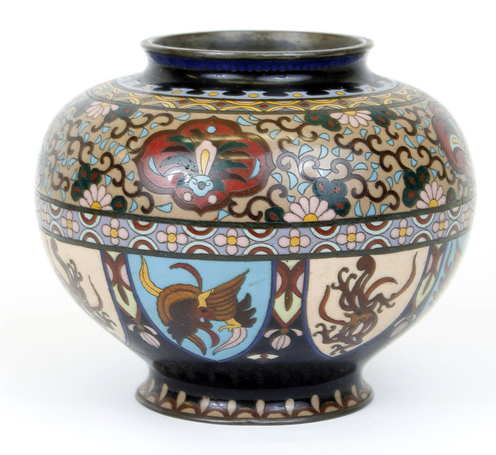 CLOISONNE MEIJI ENAMEL ON METAL URN: Cloisonne enamel on metal urn in Meiji style. Dragons and Phoenix around base with intricate floral and vine design all around top. Small damage to rear of urn. 7.5" across x 6"H Condition: Very fine