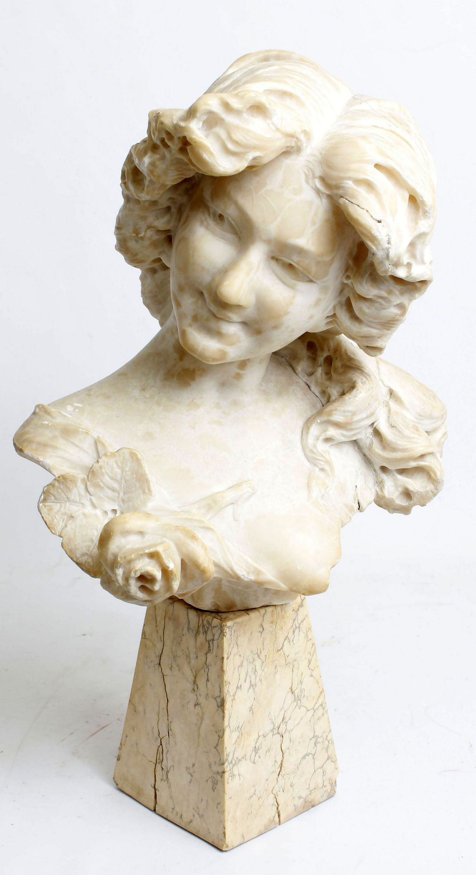 WHITE TRAVERTINE BUST YOUNG GIRL WITH ROSE: White travertine French bust sculpture, some chipping and repaired crack. (see photos). Young girl with rose, 18" tall. Condition: Some Damage.Travertine