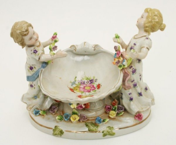 LATE 19TH CENTURY CHINA COMPOTE MEISSEN TYPE MARK: LATE 19TH CENTURY CHINA COMPOTE MEISSEN TYPE MARK China compote held by two girls, blue crossed sword (Meissen type) mark to the base. Size: 6 Condition: VGC EST. $100-200