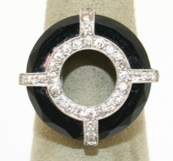 DESIGNER ART DECO 14K WHITE GOLD DIAMOND RING: DESIGNER ART DECO 14K WHITE GOLD DIAMOND RING Striking designer ring. Most likely Cartier or Van Cleef. Not marked. Acquired from high end estate. Circular design of 14K white gold and diamonds, along