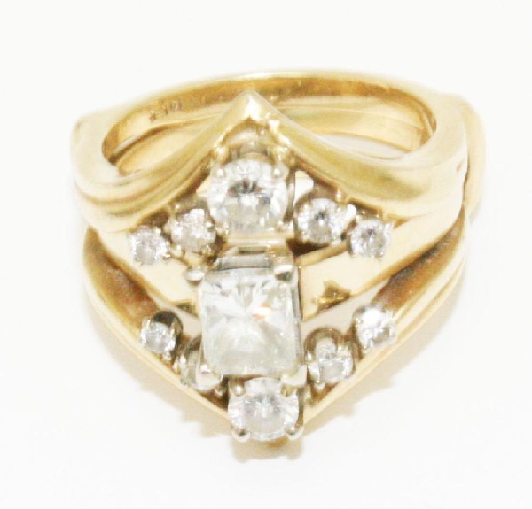 CUSTOM LADIES 1.4 CTW DIAMOND 14K YELLOW GOLD RING: CUSTOM LADIES 1.4 CTW DIAMOND 14K YELLOW GOLD RING A wonderfully designed 2 piece ring set created from diamonds taken from older family estate pieces. Consisting of a .9 Ct. emerald cut center stone 