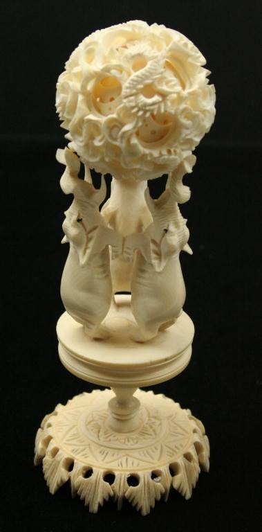 IVORY PUZZLE BALL WITH ELEPHANT STAND: IVORY PUZZLE BALL WITH ELEPHANT STAND Ivory puzzle ball on elephant stand. Unsigned. Size: 5.5" Condition: VGC EST. 75-150