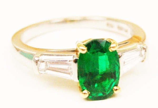 TIFFANY EMERALD AND DIAMOND RING: TIFFANY EMERALD AND DIAMOND RING Tiffany & Company Platinum and 18K yellow gold emerald and diamond ring. Genuine green 1.33 Ct natural emerald. Oval shape 8.7x5.91x4.02 mm, Clarity enhanced and certi