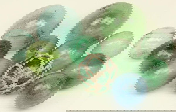 ALASKA FOUND JAPANESE GLASS FISHING FLOATS: ALASKA FOUND JAPANESE GLASS FISHING FLOATS A collection of eleven green and blue glass fishing floats. All were found by the consignor over a 30 year period on the Alaskan coastline. Most were collect