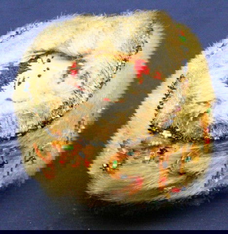 ALASKAN ESKIMO SEAL SKIN GAME BALL: ALASKAN ESKIMO SEAL SKIN GAME BALL A vintage, hand made game ball of seal skin with added "49th State" and "Alaska" in seal skin letters and glass bead decoration. Size: 3.5" Condition: VGC EST. $100-