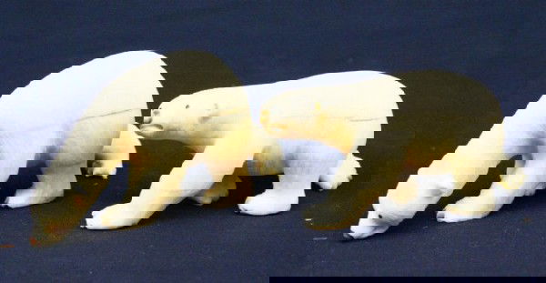 ALASKAN ESKIMO WALRUS TUSK IVORY POLAR BEARS: ALASKAN ESKIMO WALRUS TUSK IVORY POLAR BEARS Two very well carved and detailed ivory polar bears. Both are signed "Ungaluk". Size: 3.5" long Condition: VGC EST. $200-400