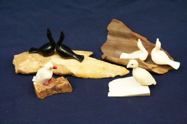 ALASKAN WALRUS TUSK IVORY BIRD FUGURES: ALASKAN WALRUS TUSK IVORY BIRD FUGURES A small lot of walrus tusk ivory bird figures, all mounted to tusk or bone. All are signed. Size: up to 2" EST. $100-300