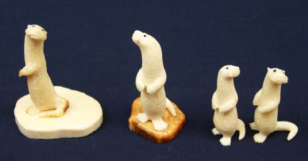 ALASKAN WALRUS TUSK IVORY CARVED OTTERS: ALASKAN WALRUS TUSK IVORY CARVED OTTERS Four carved ivory otters. Two are signed by the artist. Size: 1.75" to 2.5" Condition: VGC EST. $150-300