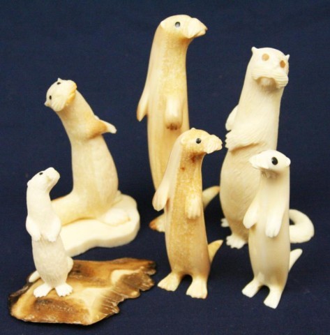 ALASKAN WALRUS TUSK IVORY CARVED OTTERS: ALASKAN WALRUS TUSK IVORY CARVED OTTERS A mixed lot of 6 carved ivory otters. All are signed by the artist. Size: 2.25" to 4" Condition: VGC EST. $200-300
