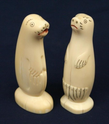 TWO ALASKAN WALRUS TUSK IVORY CARVED SEALS: TWO ALASKAN WALRUS TUSK IVORY CARVED SEALS Two naive carved ivory seals. Both are signed by the artist. Size: 4" Condition: VGC EST. $100-300