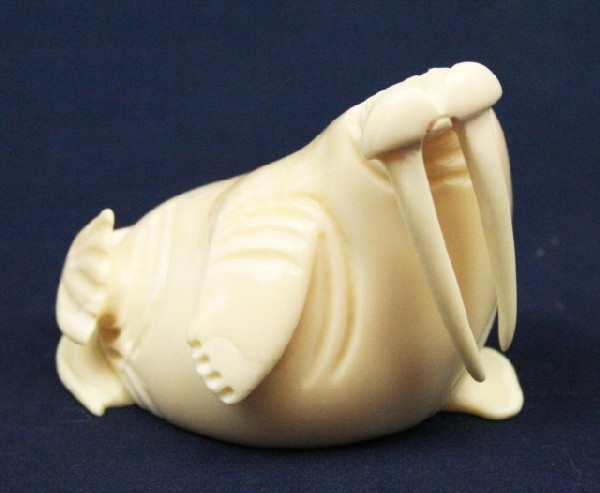 ALASKAN ESKIMO WALRUS TUSK IVORY WALRUS FIGURE: ALASKAN ESKIMO WALRUS TUSK IVORY WALRUS FIGURE A well detailed carved ivory walrus. Signed, "A.H.S." by the artist. Size: Near 4" Condition: VGC EST. $200-400