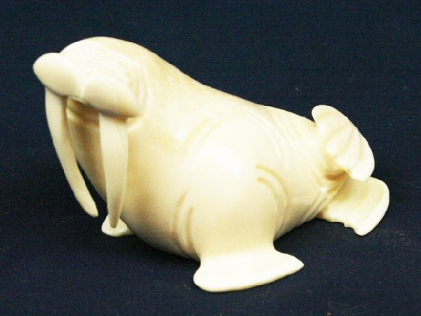 ALASKAN ESKIMO WALRUS TUSK IVORY WALRUS FIGURE: ALASKAN ESKIMO WALRUS TUSK IVORY WALRUS FIGURE A carved ivory walrus. Signed, "A.H.S." by the artist. Size: 3" Condition: VGC EST. $100-300