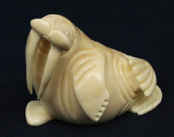 ALASKAN ESKIMO WALRUS TUSK IVORY WALRUS FIGURE: ALASKAN ESKIMO WALRUS TUSK IVORY WALRUS FIGURE A carved ivory walrus. Signed, "A.H.S." by the artist. Size: 3" Condition: VGC EST. $100-300