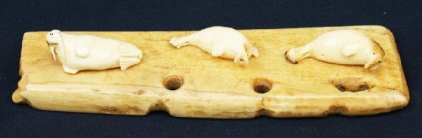 ALASKAN ESKIMO WALRUS TUSK IVORY WALRUS FIGURES: ALASKAN ESKIMO WALRUS TUSK IVORY WALRUS FIGURES A carved ivory walrus pod or group. Signed by the artist. Size: 7.5" Condition: VGC EST. $100-300