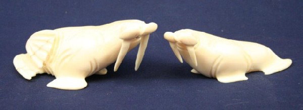 ALASKAN ESKIMO WALRUS TUSK IVORY WALRUS FIGURES: ALASKAN ESKIMO WALRUS TUSK IVORY WALRUS FIGURES A carved ivory walrus figures. One is signed, "A.H.S." by the artist. The larger one a repair to one tusk. Size: 3.5" & 4.5" Condition: VGC EST. $150-30