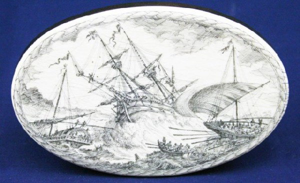 DRAMATIC SCRIMSHAW ON IVORY SHIP SCENE PICTURE: DRAMATIC SCRIMSHAW ON IVORY SHIP SCENE PICTURE An oval scrimshaw picture showing a naval scene of ships in a storm. The ivory is mounted to a wood backing base and stand. Early 20th century. Size: 5.5