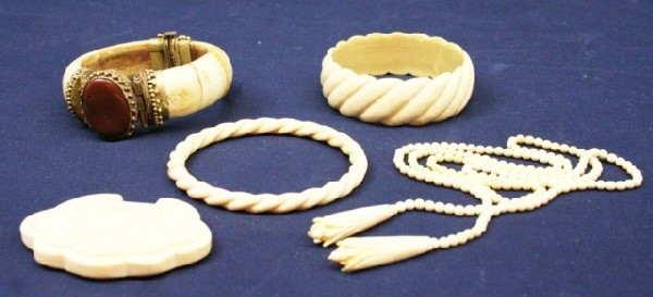IVORY BRACELET & NECKLACE LOT: IVORY BRACELET & NECKLACE LOT 2 ivory bangle bracelets. Beaded necklace. Carved pendant of 2 dragons. A hinged bangle bracelet with large stone. Condition: VGC EST. $200-400