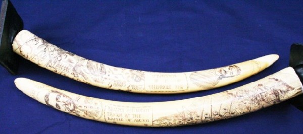 ELEPHANT TUSK SCRIMSHAW BRITISH ABYSSINIA CAMPAIGN: ELEPHANT TUSK SCRIMSHAW BRITISH ABYSSINIA CAMPAIGN A pair of elephant ivory tusks with scrimshaw type design work showing the British campaign of Abyssinia (Ethiopian empire) of 1868. This well execut