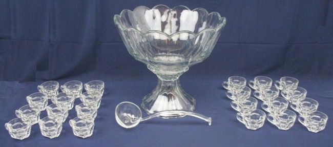 HEISEY GLASS PUNCH BOWL W/ LADLE & 24 CUPS: HEISEY GLASS PUNCH BOWL W/ LADLE & 24 CUPS Heisey punch bowl and foot with ladle and 24 cups. Pattern #429 Plain Panel Recess. This pattern is dated from 1910 to 1925. Size: 15" Condition: VGC Est. 20