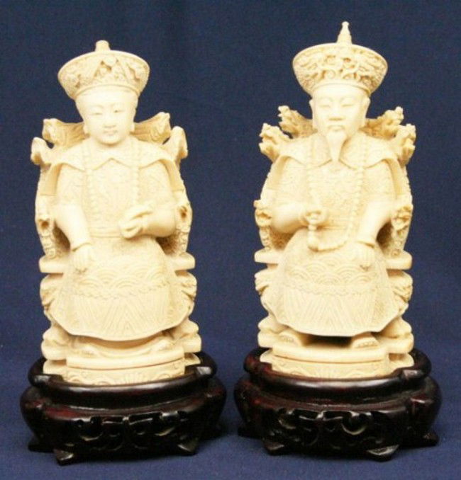 PAIR CHINESE CARVED IVORY SEATED EMPEROR & EMPRESS: PAIR CHINESE CARVED IVORY SEATED EMPEROR & EMPRESS A very well carved pair of figures standing 6 inches on their wood bases. Both are elephant ivory and both are signed to the base by the artist. The