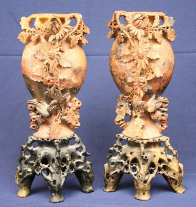 PAIR OF CHINESE HAND CARVED SOAPSTONE VASES: PAIR OF CHINESE HAND CARVED SOAPSTONE VASES Chinese soapstone vases with intricate floral and bird of paradise carvings. Affixed to carved stone bases. Size: 9 Inches Condition: GC Minor chips Est. 10