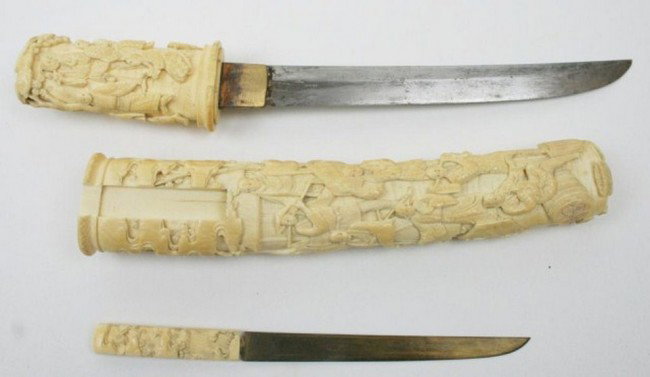 ANTIQUE CARVED IVORY MOUNTED TANTO MEIJI PERIOD: ANTIQUE CARVED IVORY MOUNTED TANTO MEIJI PERIOD A very well executed hand carved elephant ivory tanto grip and sheath with a steel Blade of 7.5 inches. Along with fitting Ivory handled kozuka. Conditi