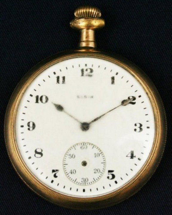 ELGIN POCKET WATCH: ELGIN POCKET WATCH An Elgin 17 jewel pocket watch. Case measures 48.4mm in diameter. Balance wheel staff needs repair, bow is missing, crystal has scratches and back case is dented. Size: 12 Condition