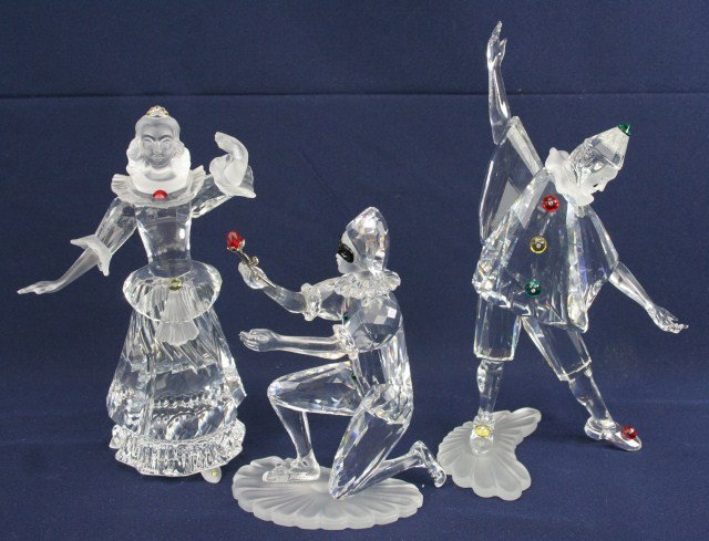 SWAROVSKI CRYSTAL MASQUERADE SERIES 1999-2001: SWAROVSKI CRYSTAL MASQUERADE SERIES 1999-2001 3 retired Swarovski Crystal figures from the Masquerade series (mask absent). 1999 Pierrot in box, 2000 Columbine in box, and 2001 Harlequin. Designed by 
