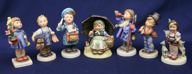 7 GOEBEL HUMMEL TMK 6 #17 85 143 200 113 15 408: 7 GOEBEL HUMMEL TMK 6 #17 85 143 200 113 15 408 Goebel Hummel figures TMK6; "Congratulations" #17/0 5.5", "Serenade" #85/0 4.75", "Boots" #143/0 5", "Little Goat Herder" #200/0 4.5", "Postman" #119/0 