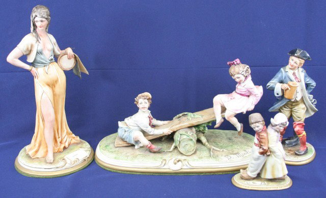 LOT 4 MERLI CAPODIMONTE FIGURES: LOT 4 MERLI CAPODIMONTE FIGURES 4 B. Merli capodimonte figures. 2 children, a man, a Gipsy, and 2 children on a see-saw. Size: 5" to 11.5" tall Condition: VGC Est. $200 - 400