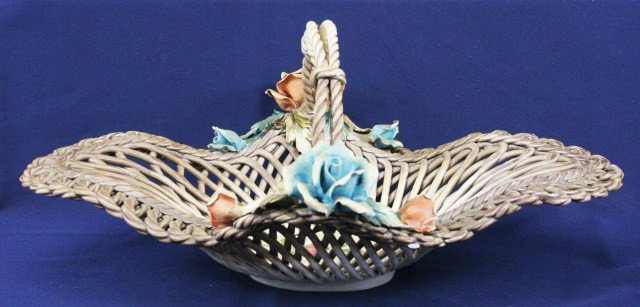LARGE CAPODIMONTE FLORAL BASKET: LARGE CAPODIMONTE FLORAL BASKET A large capodimonte floral basket adorned with flowers. Size: 14.5" x 9" x 7" Condition: VGC Est. $50 - 150