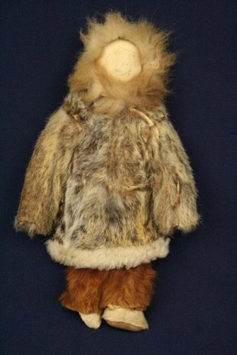 ANTIQUE ALASKAN ESKIMO DOLL: ANTIQUE ALASKAN ESKIMO DOLL An Alaskan Eskimo doll from the late 19th century or early 20th century. Made of seal skin and rabbit or otter fur. Originally purchased in Alaska during the Klondike Gold 