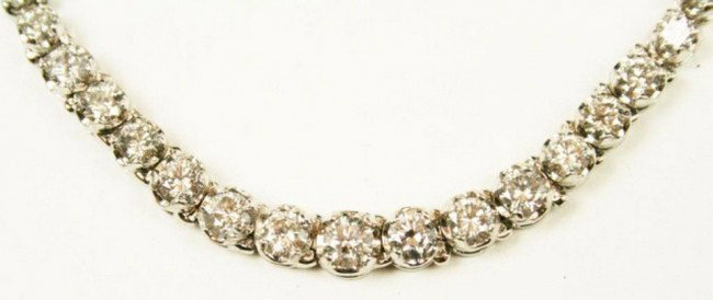 LADIES 14K WHITE GOLD 11CT DIAMOND NECKLACE: LADIES 14K WHITE GOLD 11CT DIAMOND NECKLACE Ladies 14k white gold necklace with 109 brilliant cut diamonds giving a total weight of 11.01 carats. of SI2 and SI1 clarity. with a color grade of H-J. The