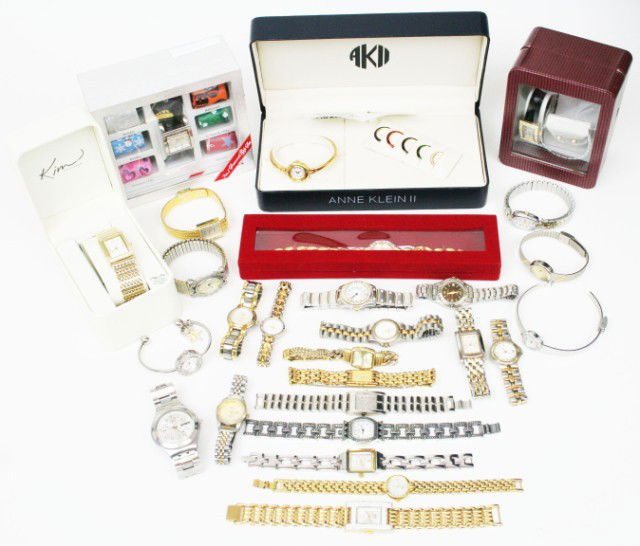 DEALERS LOT OF 27 WOMEN WRIST WATCHES: DEALERS LOT OF 27 WOMEN WRIST WATCHES 27 wrist watches of different names and sizes with 1 pair of ladies earrings. This lot of women watches contain; Anne Klein II, Boca, Gucci, Gruen, CW, Calinda, T