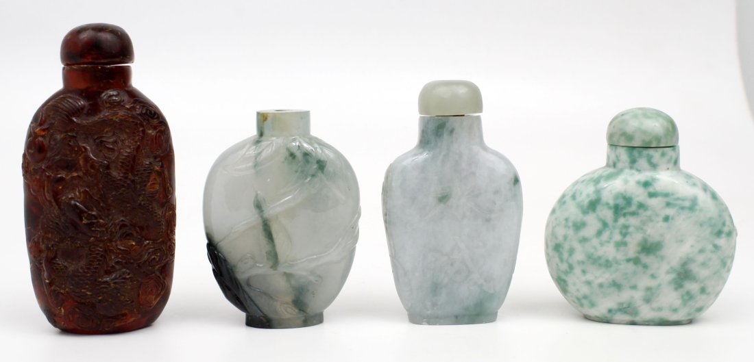 4 CHINESE SNUFF BOTTLES: 4 Chinese snuff bottles- One is Amber, and the other 3 are jadeite. The lid is missing on one of the jadeite bottles and the spoons are not attached.Condition: Good, No chips, cracks, or repairs to bo