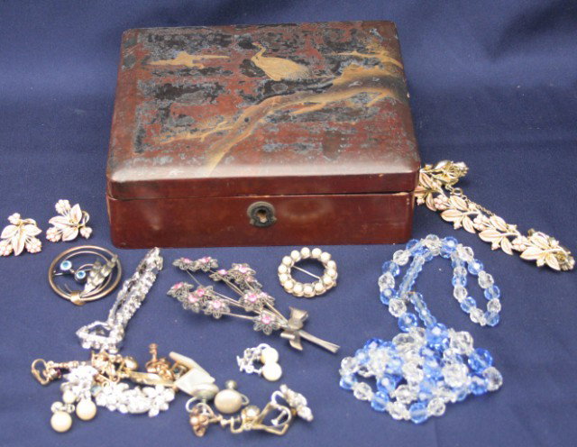 28 PIECE COSTUME JEWELRY LOT: 28 PIECE COSTUME JEWELRY LOT 1 beaded necklace, 2 bracelets, 3 brooches (one is silver), and 11 pairs of earrings (clip on and screw backs). All contained in a lacquered Japanese wooden box. Condition