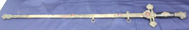 KNIGHTS TEMPLAR FRATERNAL SWORD - DM DOWNER: KNIGHTS TEMPLAR FRATERNAL SWORD - DM DOWNER Knights Templar sword with scabbard. Crossguard and shield with crowned enameled maltese cross, the reverse having a cast cross. The blade is etched to DM D