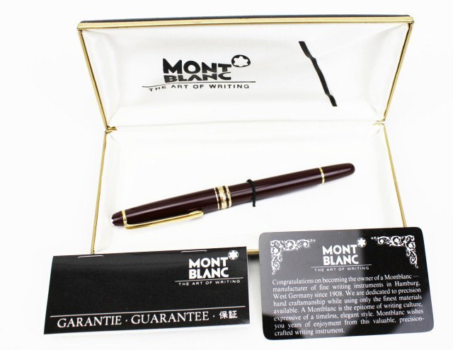 MONTBLANC MEISTERSTUCK CLASSIQUE BURGANDY RB: MONTBLANC MEISTERSTUCK CLASSIQUE BURGANDY RB Montblanc Meisterstuck Classique rollerball burgundy and gold pen. Plated gold clip and rings with emblem on cap. Ident. No. 12890 in original box. Size: 5