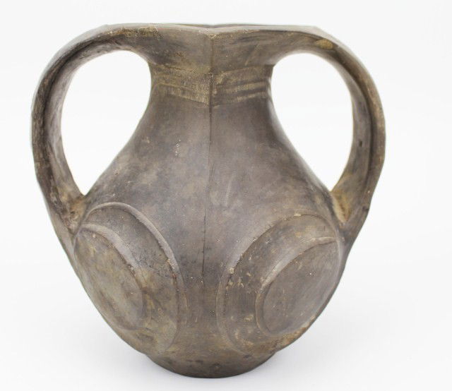 CHINESE HAN DYNASTY POTTERY AMPHORA VASE: CHINESE HAN DYNASTY POTTERY AMPHORA VASE A black / grey two-handle Han Dynasty (206 BC-220 AD) Chinese amphora vase, with swirling design motif. Size: 7.25" Condition: VGC Est.$200-400