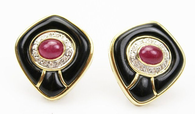 VAN CLEEF STYLE 18K RUBY & ONYX EARRINGS: VAN CLEEF STYLE 18K RUBY & ONYX EARRINGS A pair of mid-century 18K yellow gold earrings lust with onyx and centered by two 6 x 4mm cabochon rubies. Brilliant diamonds embrace the rubies, totaling .80c