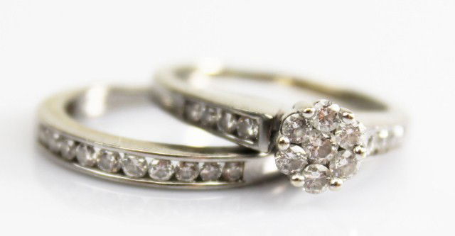 14K GOLD DIAMOND WEDDING SET: 14K GOLD DIAMOND WEDDING SET 14K white gold flower cluster diamond engagement ring with wedding band. Engagement ring features 7 diamonds in a flower design with 4 accent diamonds on both sides of the