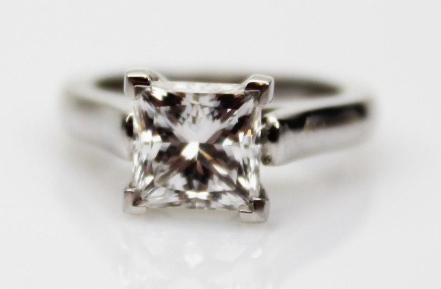 2 CARAT PRINCESS CUT DIAMOND ENGAGEMENT RING: 2 CARAT PRINCESS CUT DIAMOND ENGAGEMENT RING An elegant solitaire engagement ring, 2.01 carats in exceedingly rare F color and VS-1 clarity. Excellent polish and symmetry with blue florescence. 6.78mm